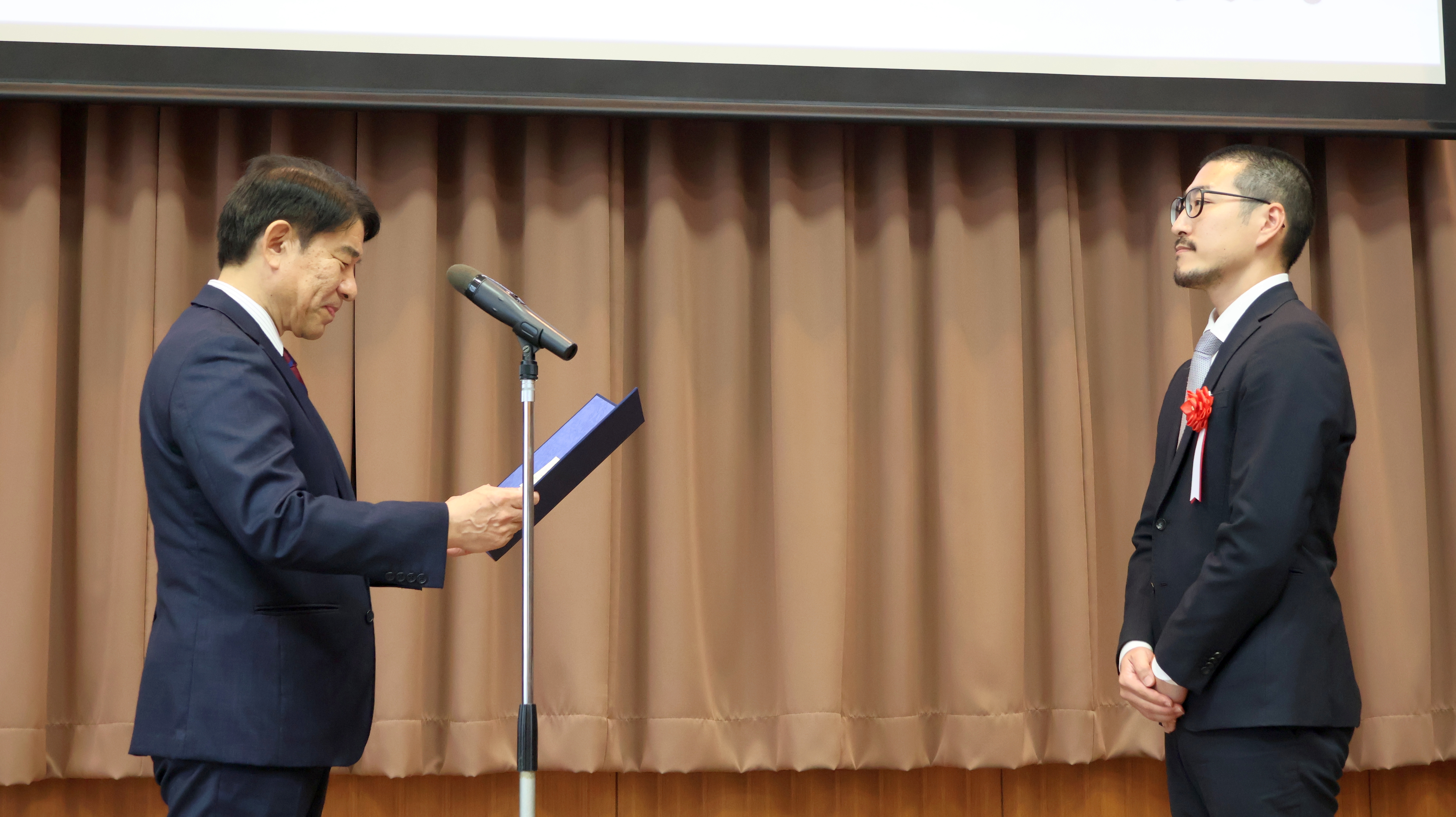 Award-winner receiving certificate